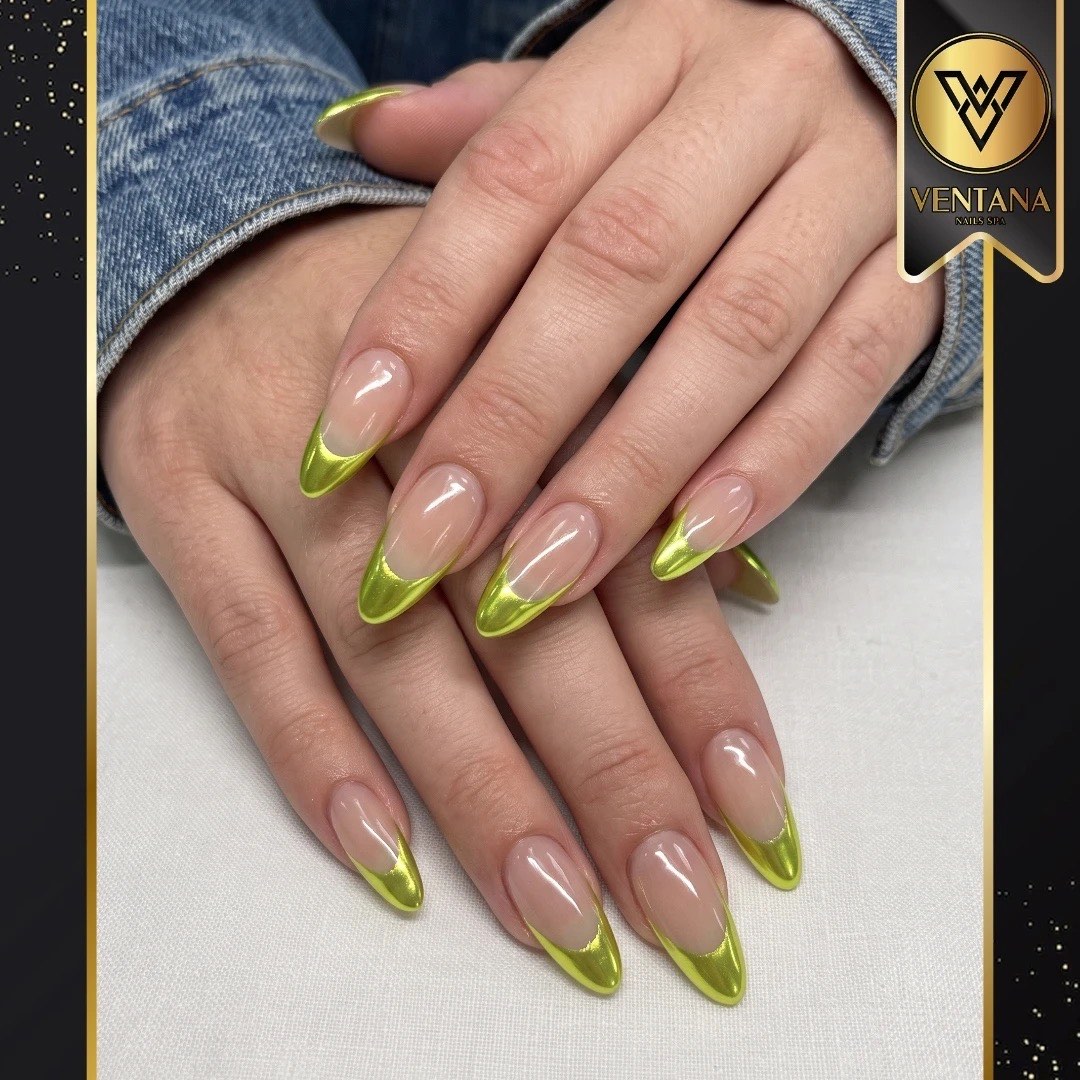 Almond nails with glossy lime green French tips on a nude base